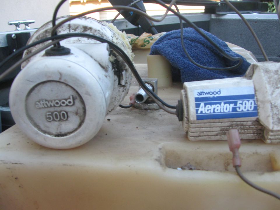 Two attwood aerator 500 pumps on a boat's deck
