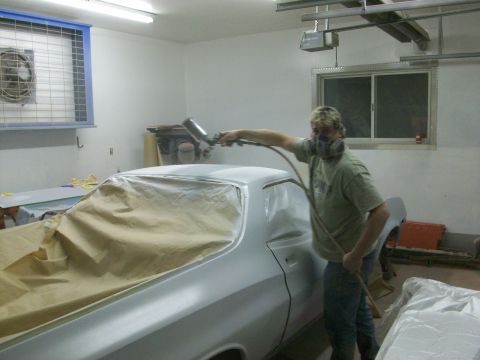 1973 Ford Ranchero - Kim is laying on the first coat of Omni MH283 hi-build primer; he'll put on two coats, most of which we will sand off.