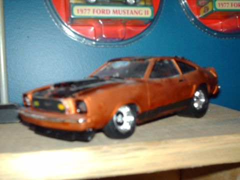 1978 Ford Mustang II - Toy car model of a 1977 Ford Mustang II displayed with its packaging.