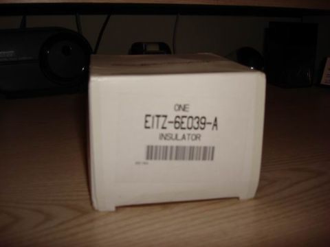 1984 Ford Bronco - A white cardboard box displays the part number E1TZ-6E039-A and the label INSULATOR.
