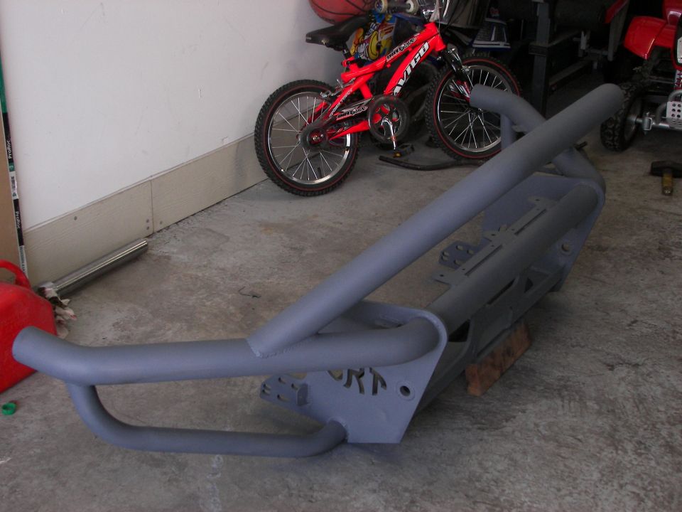 Gray custom front bumper with prominent tubing and visible "ORN" cutout