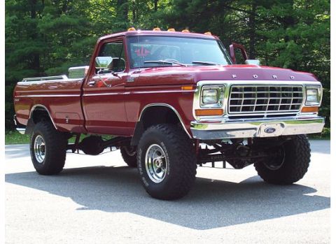 1978 Ford F-150 - This lifted 1978 Ford F-150 pickup truck is shown from a three-quarter front view, parked outdoors.