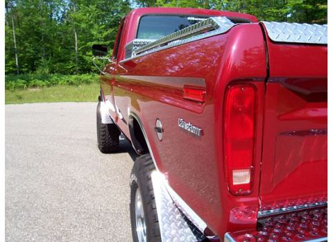 1978 Ford F-150 - This red pickup truck has diamond plate accents on the bed and fenders.