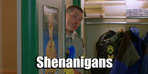 2001 Ford Crown Victoria - A man in uniform peeks around a doorway, with the word "Shenanigans" overlaid on the image.