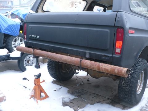 1979 Ford Bronco - Ford Bronco rear end with a custom pipe bumper installed, snow on the ground.
