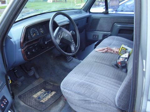 1996 Ford F-150 - Interior view of a 1996 Ford F-150, showing the dashboard, steering wheel, and bench seat.
