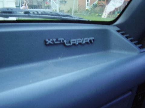 1996 Ford F-150 - The dashboard displays an XLT Lariat emblem, indicating a trim level rather than a specific model year.