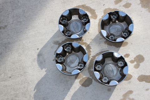 1998 Ford Crown Victoria - Set of four hubcaps for sale, condition as shown in the photo.