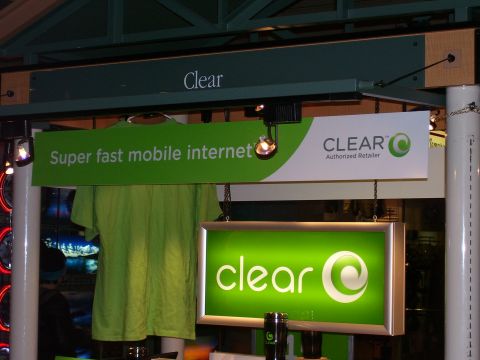 1991 Ford Bronco - A retail display for Clear mobile internet features green signage and a t-shirt.