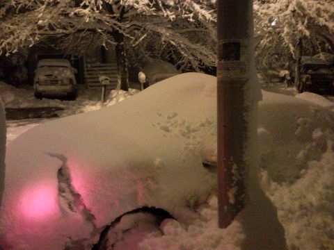2007 Subaru Impreza - Multiple vehicles are buried under heavy snow during a winter storm.