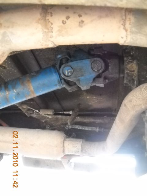 1979 Ford Bronco - Undercarriage view showing the driveshaft and exhaust system of a vehicle.