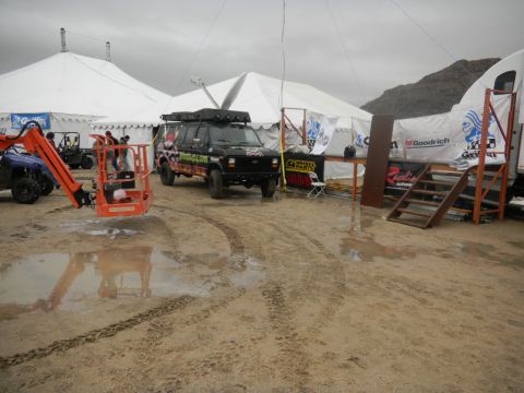 1997 Ford Ranger - A modified van is parked at an outdoor event with tents and other vehicles present.