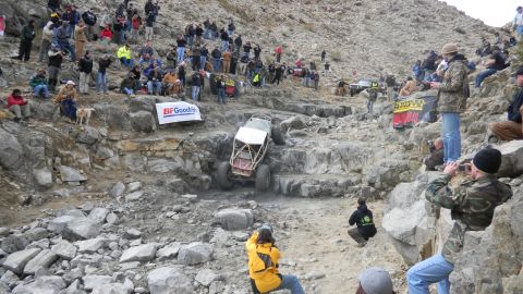 1997 Ford Ranger - Spectators gather to watch an off-road vehicle tackle a challenging rocky terrain during an event.