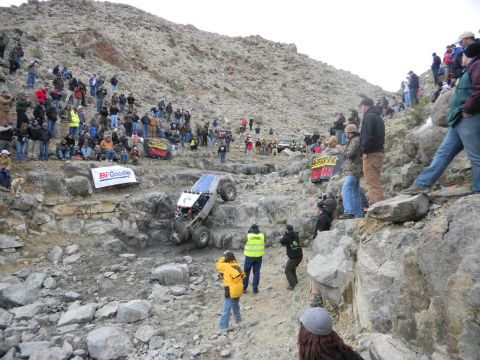 1997 Ford Ranger - Spectators watch an off-road race vehicle tackle a difficult rocky course.