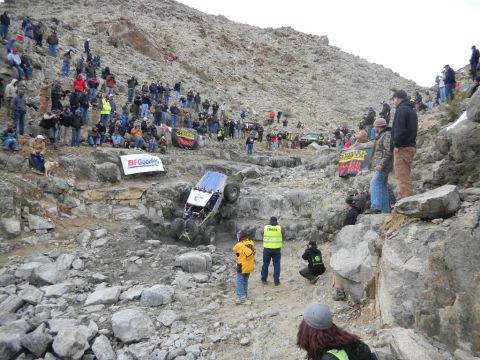 1997 Ford Ranger - A crowd watches an off-road vehicle navigate a difficult rocky terrain during a competition.
