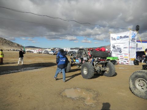 1997 Ford Ranger - An off-road buggy is parked in a dirt lot, with tents and other vehicles visible in the background.
