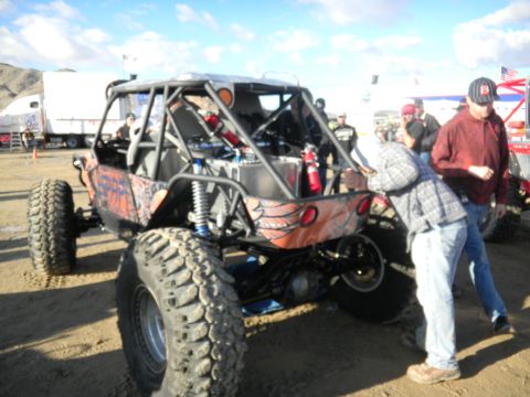 1997 Ford Ranger - A custom-built off-road buggy with a distinctive orange rear panel and large tires is shown from the back.