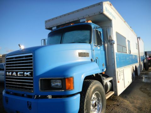 1997 Ford Ranger - This blue Mack truck has been converted into a motorhome, seen from the front 3/4 angle.