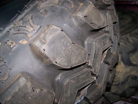 2001 Dodge 1500 - Aggressive tread pattern on an off-road tire, showing deep lugs and siping.