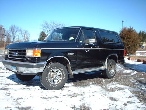 1989 Ford Bronco - This 1989 Ford Bronco is parked in a snowy lot under a clear blue sky.