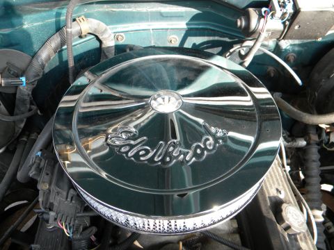 1995 GMC Sierra 1500 - Close-up of an engine bay, focusing on a chrome air cleaner assembly.