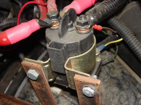 1992 Ford Bronco - Close-up of a vehicle's starter solenoid and associated wiring.