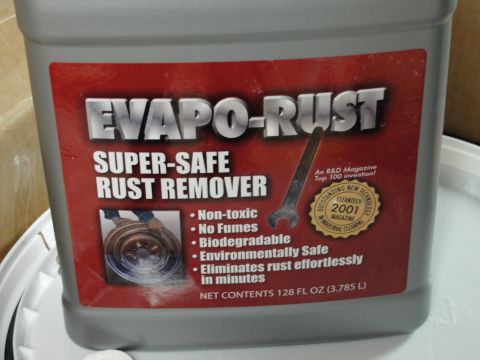 1995 Ford Bronco - A close-up of a container of Evapo-Rust, a super-safe rust remover that is non-toxic and biodegradable.