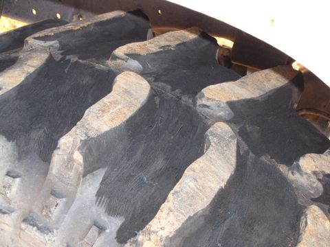 1995 Ford Bronco - Aggressive tread pattern visible on a large tractor tire, likely for off-road use.