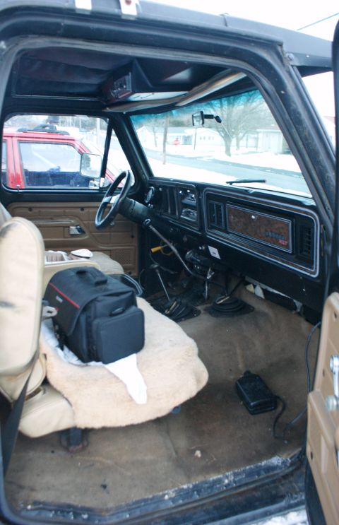 1979 Ford Bronco - Interior view of a 1979 Ford Bronco, showing the dashboard, seats, and floor shifter.