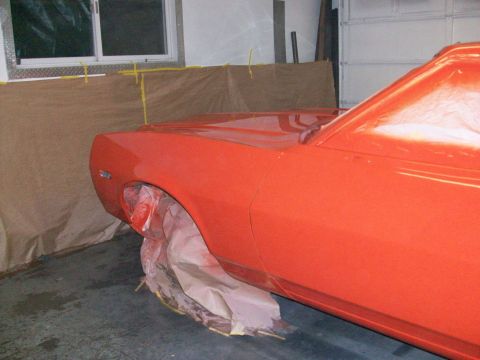 1973 Ford Ranchero - The vehicle is in a garage, covered in plastic sheeting and paper for a paint job.