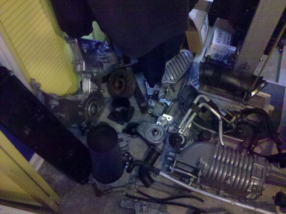Supercharger and other engine parts scattered on floor