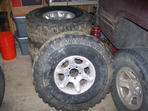 2001 Dodge 1500 - Spare tires are shown in this image, with one tire a silver alloy wheel.