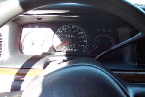 2001 Ford Crown Victoria - Interior view of a vehicle's dashboard, showing the speedometer, odometer, and other gauges.