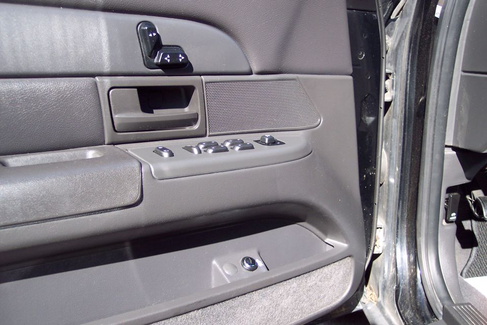 2001 Ford Crown Victoria interior door panel with power window controls