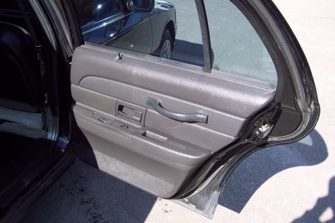 2001 Ford Crown Victoria - Interior view of the driver's side door panel on a 2001 Ford Crown Victoria.
