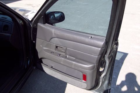 2001 Ford Crown Victoria - Interior view of the driver's side door panel of a 2001 Ford Crown Victoria.