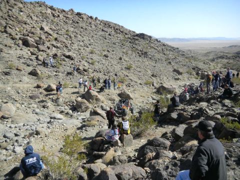 1997 Ford Ranger - Spectators watch an off-road race unfold on a rocky, desert-like terrain.