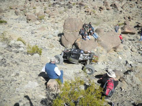 1997 Ford Ranger - Spectators watch an off-road buggy ascend a challenging rocky terrain.