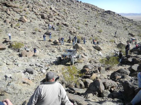 1997 Ford Ranger - Spectators watch an off-road vehicle navigate a challenging rocky terrain during an event.