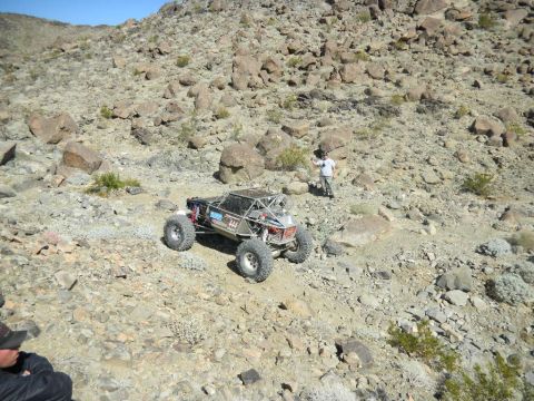 1997 Ford Ranger - Custom off-road buggy navigates challenging rocky terrain under a clear blue sky.