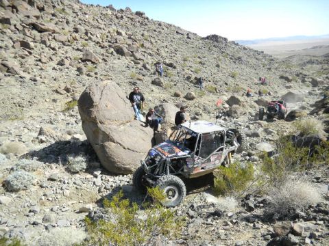 1997 Ford Ranger - A custom off-road buggy navigates a challenging rocky course during a desert race event.