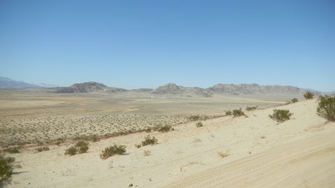1997 Ford Ranger - Wide desert vista with mountains in the background and scrub brush in the foreground.