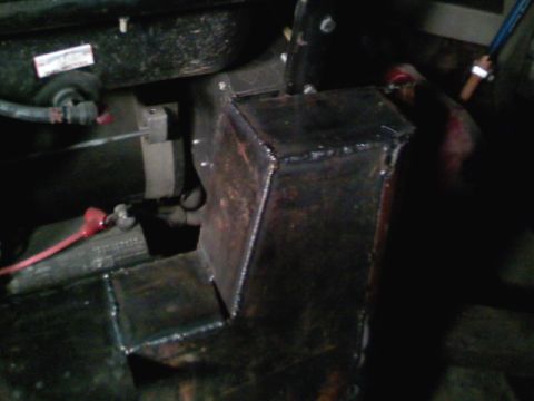 1990 Ford Bronco - A close-up view of a custom-welded metal bracket, likely a modification or repair part.