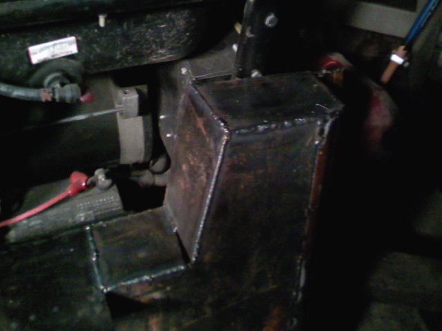 welded metal bracket attached to vehicle frame