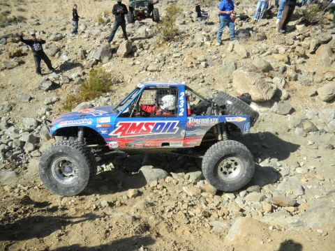 1997 Ford Ranger - Off-road race truck navigates a challenging rocky terrain during an event.