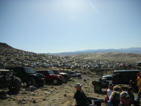 1997 Ford Ranger - A large gathering of off-road vehicles in a desert environment, with spectators in the foreground.