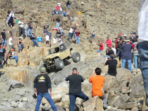 1997 Ford Ranger - Spectators watch an off-road vehicle navigate a challenging rocky terrain.