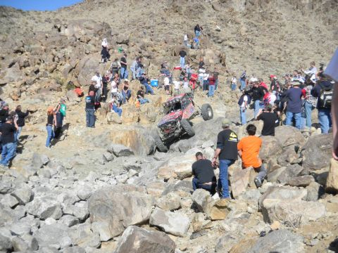 1997 Ford Ranger - Spectators watch an off-road buggy navigate a challenging rocky terrain during an event.