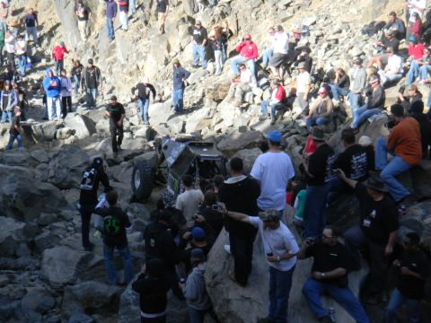 1997 Ford Ranger - Spectators gather to watch an off-road buggy attempt to navigate a challenging rocky course.