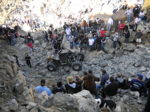 1997 Ford Ranger - Spectators gather to watch an off-road buggy tackle a challenging rocky terrain.